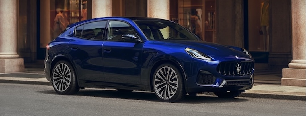 A blue 2025 Maserati Grecale sits on a street.