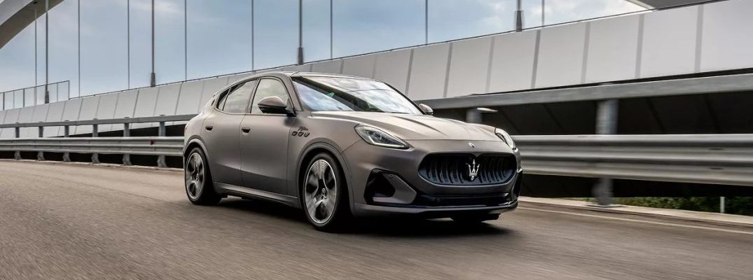A 2025 Maserati Grecale Folgore drives on a bridge.